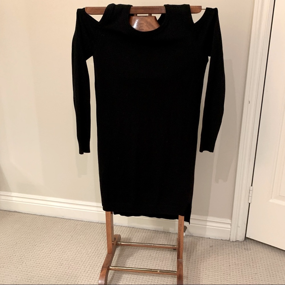 Cold shoulder midi black knit dress with long sleeves.